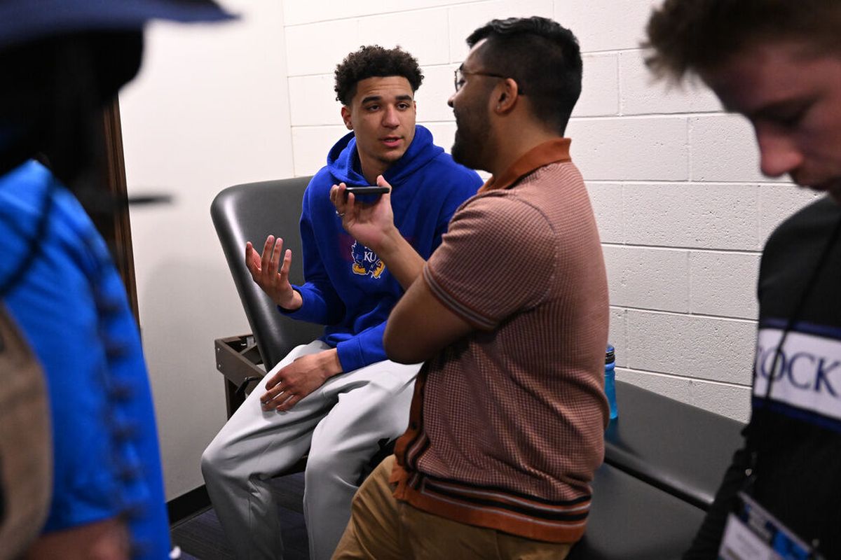 Kansas Jayhawks guard Kevin McCullar Jr. answers questions from a journalist during an open locker room Friday in Salt Lake City.  (Tyler Tjomsland / The Spokesman-Review)
