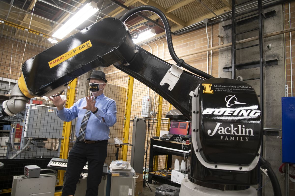 Professor John Shovic talks about the potential uses of the giant articulated arm robot in the University of Idaho robotics lab at North Idaho College in Coeur d’Alene, the new location of the program that his been in Coeur d’Alene for three years. The robot was donated by Boeing. The Coeur d’Alene-based program offers advanced degrees in robotics.  (Jesse Tinsley/THE SPOKESMAN-REVI)