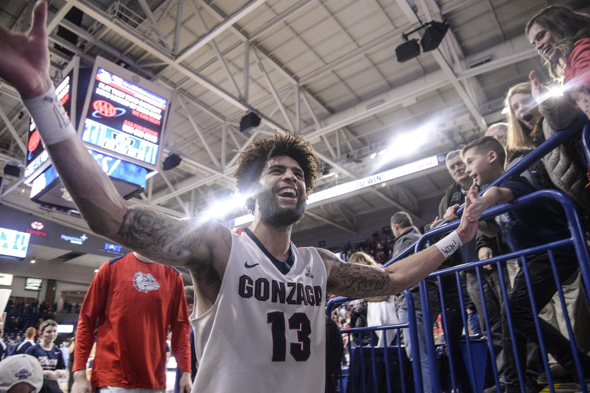 Gonzaga guard Josh Perkins celebrates with fans after defeating BYU, Saturday, Feb. 3, 2018, in the McCarthey Athletic Center. (Dan Pelle / The Spokesman-Review)