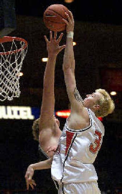 
Eastern Washington's Paul Butorac, right, gets his shot up and over Butler's Jamie Smalligan in the first half Thursday.
 (Associated Press / The Spokesman-Review)
