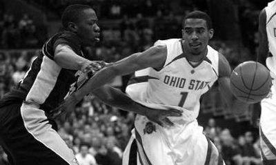 
Ohio State's Mike Conley Jr. (1) drives to the basket as Purdue's Marcus Green, left, defends. 
 (Associated Press / The Spokesman-Review)