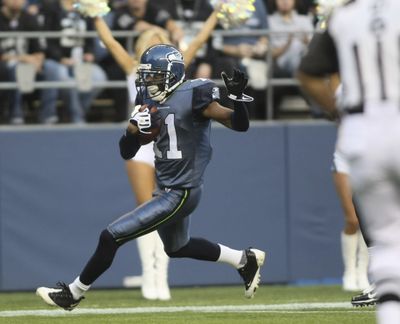 Seattle Seahawks’ Deon Butler scores a touchdown in the first quarter.  (Associated Press / The Spokesman-Review)