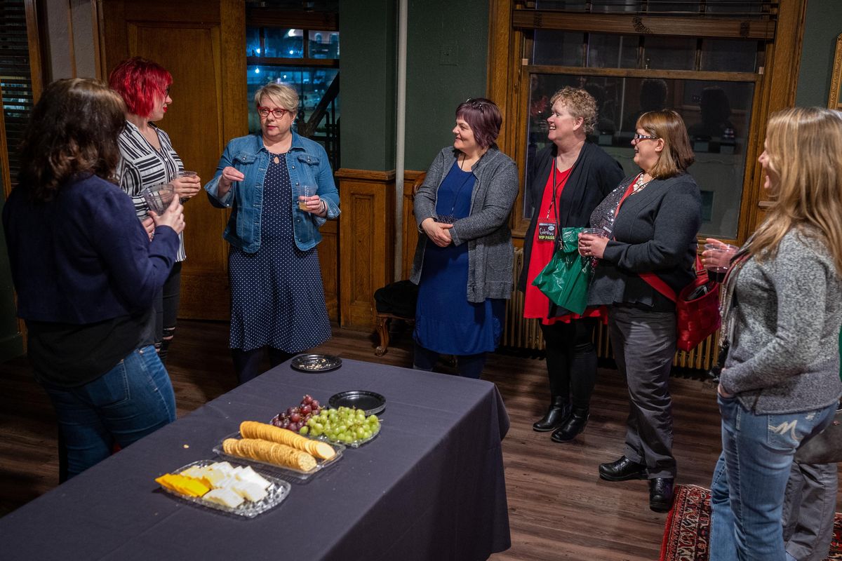 Romance authors, Katie Roberts and Asa Maria Bradley, second and third from left, discuss their work at the during Auntie's Presents - Galentine's Day, A Northwest Passages Event held, Mon. Feb., 24, 2020, at the Montvale Event Center. (Colin Mulvany / The Spokesman-Review)
