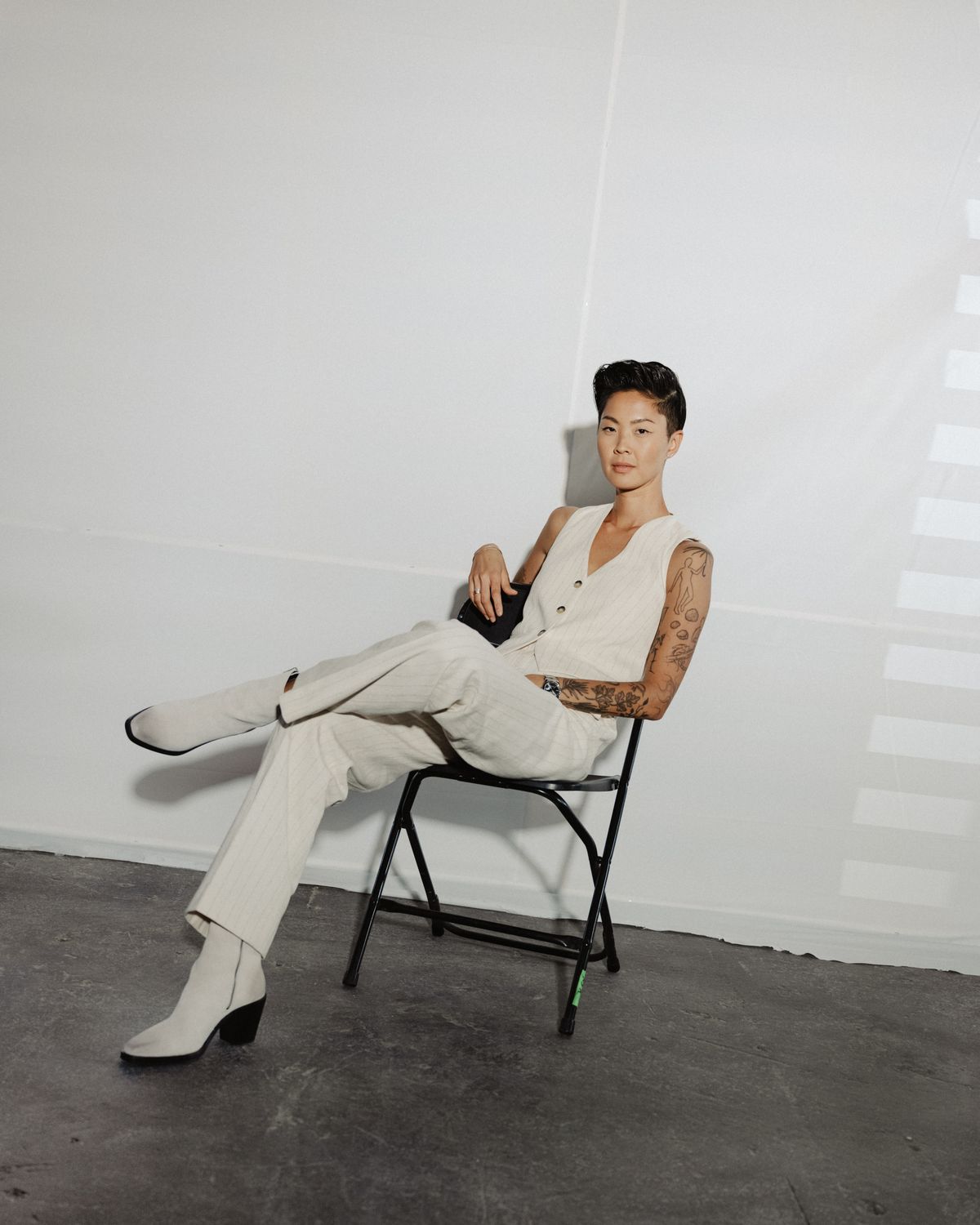 Kristen Kish, the former “Top Chef” champion who is replacing Padma Lakshmi as the show’s permanent host, on set in Milwaukee on Aug. 16, 2023. If Kish had a brand, it might be wrapped in millennial pink and laced with the ideals of a generation that values earnestness, diversity and being nice. “I have severe social anxiety and I’m on television, which is wild,” she said. “I know I’m a walking contradiction.”  (LYNDON FRENCH/New York Times)
