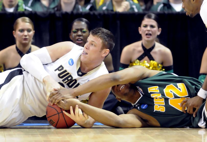 Purdue's Chris Kramer, left, battles Siena's Alex Franklin in the first half of their first-round NCAA tournament matchup at the Spokane Arena on Friday, March 19, 2010. (Jesse Tinsley / The Spokesman-Review)