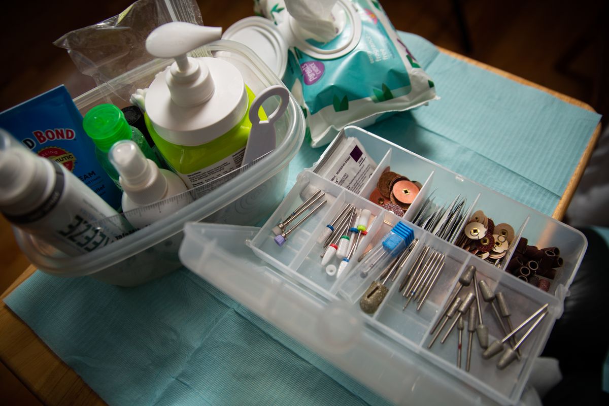 A look into a portion of the kit that Aleen Warren uses for her Feet First Spokane medical-grade foot care service on June 21, 2021 at the home of Val Hughes, one of her clients. Warren is a registered nurse who conducts in-home treatments for clients who need relief for their feet, and uses proper sterilization and disinfection protocols and medical techniques to improve her clients