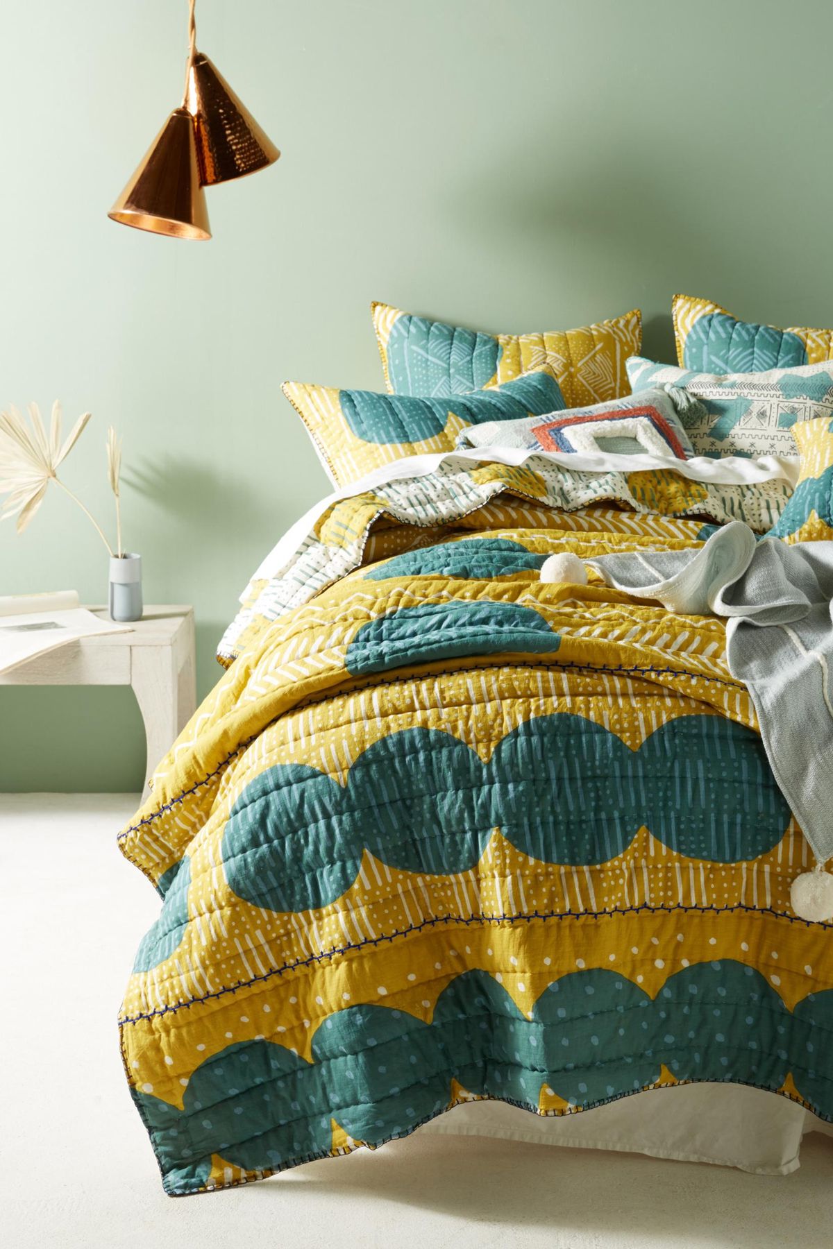 Anthropologie’s hand-embroidered Cardine Collection adds color and texture to the bedroom. (Anthropologie)