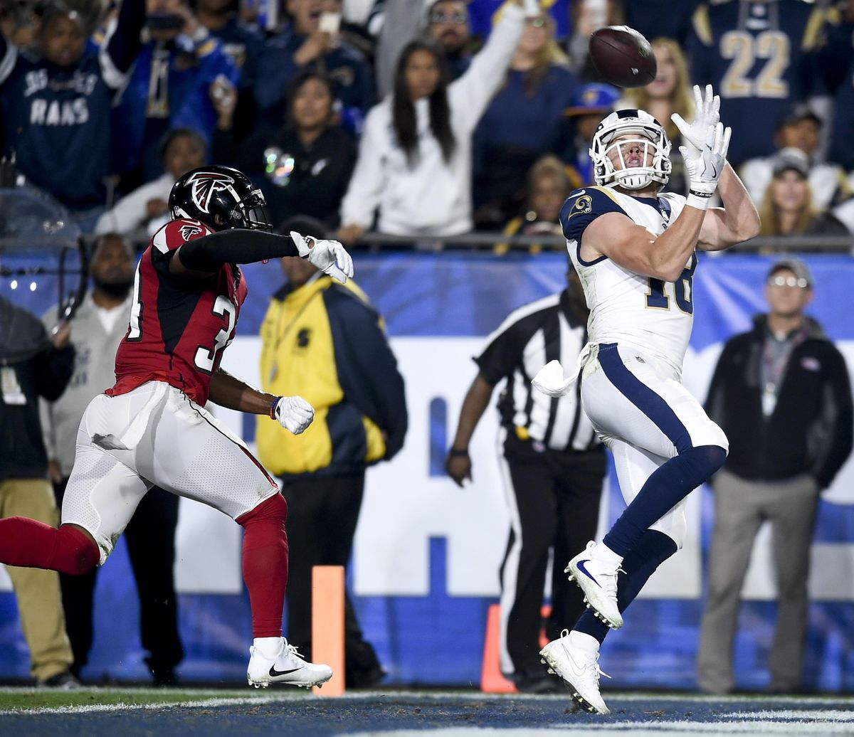 Los Angeles Rams wide receiver Cooper Kupp catches a touchdown pass over Atlanta Falcons cornerback Brian Poole during the first half of a wild-card playoff game on Jan. 6 in Los Angeles. (Kelvin Kuo / AP)