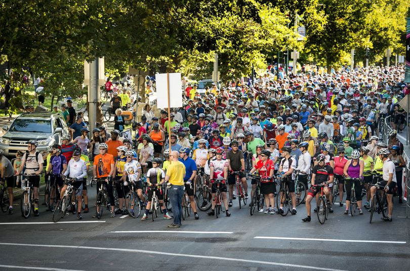 Riders line up along Spokane Falls Boulevard for the REI 21-Mile River Loop ride during SpokeFest on Sunday. (Colin Mulvany)