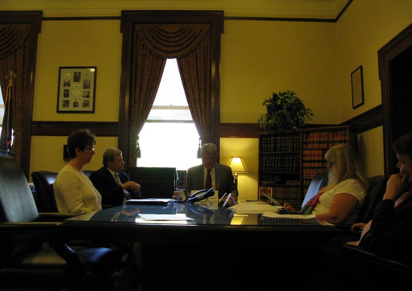 The Constitutional Defense Council, including Gov. Butch Otter, center, and Attorney General Lawrence Wasden, at left of Otter, meets on Wednesday; House Speaker Scott Bedke and Senate President Pro-Tem Brent Hill participated by phone. (Betsy Z. Russell)