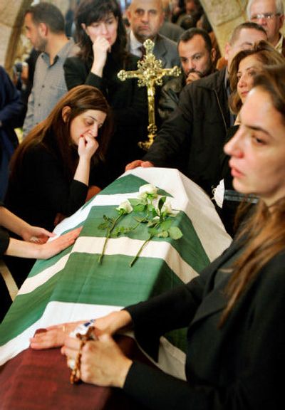
Mourners gather around the coffin of assassinated Christian politician Pierre Gemayel in Bikfaya, Lebanon, on Wednesday. 
 (Associated Press / The Spokesman-Review)