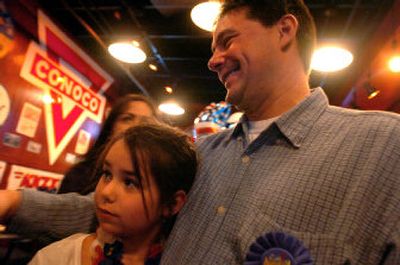 
Incumbent Post Falls city councilman Joe Bodman waits for the final returns with his daughter, Hannah, 8, at the Hot Rod Cafe in Post Falls Tuesday. He was opposed by Jackie McAvoy and Joe Doellefeld. 
 (Jesse Tinsley / The Spokesman-Review)