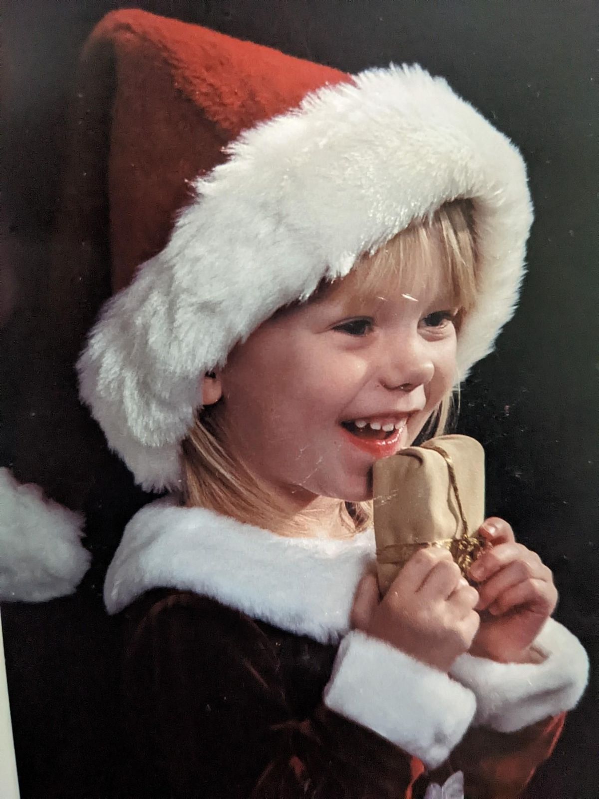 Madison Mogen, 2, in a Christmas portrait from 2003.  (Courtesy of Ben Mogen)