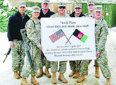 
The soldiers of the 43rd Area Support Group out of Bagram Airbase, Afghanistan, send best wishes to Junior Dance competitors Piper Gilles and Timothy McKernan. McKernan's father is stationed with the group. 
 (Photo courtesy Timothy McKernan / The Spokesman-Review)