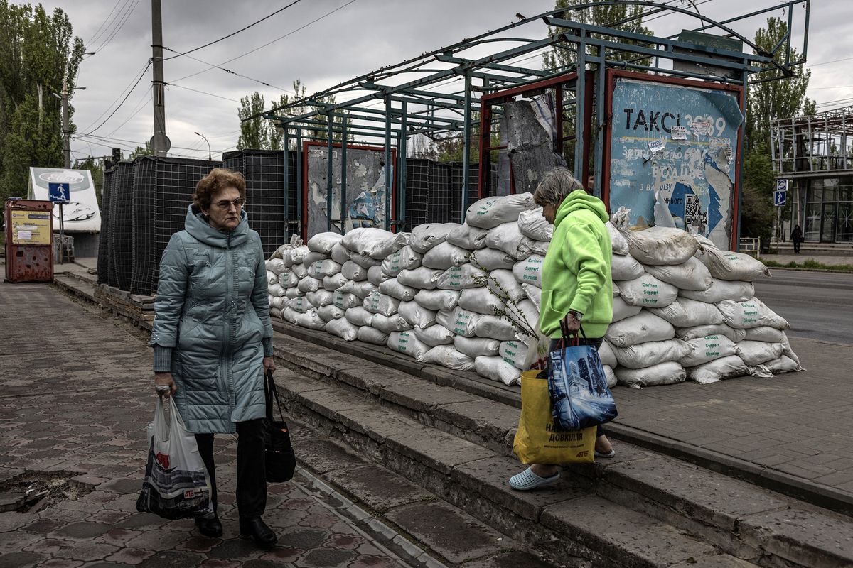 Sandbags lay around a bus stop damaged by Russian shelling in the city of Kherson, on Tuesday, May 9, 2023. No city in Ukraine has suffered the reversal of fortunes that Kherson has. Liberated in the fall, it was a symbol of hope an now it is a kill zone.    (Finbarr O