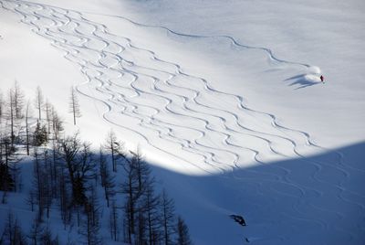 Boulder Hut mountain guide Todd Craig of Golden, British Columbia, sets a boundary to keep his clients away from avalanche danger as they prepare to make a second run down an alpine slope in the Purcell Mountains. (Rich Landers / The Spokesman-Review)