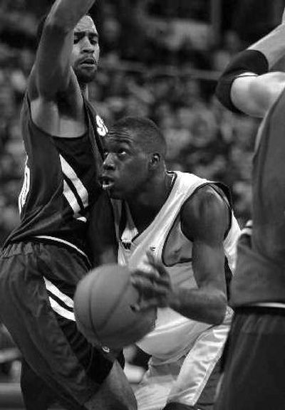 
UW's Quincy Pondexter drives against Stanford's Lawrence Hill. 
 (Associated Press / The Spokesman-Review)