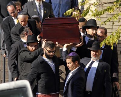 Pallbearers carry the casket of Joyce Fienberg from the Beth Shalom Synagogue following a funeral service in the Squirrel Hill neighborhood of Pittsburgh, Wednesday, Oct. 31, 2018. (Gene J. Puskar / Associated Press)