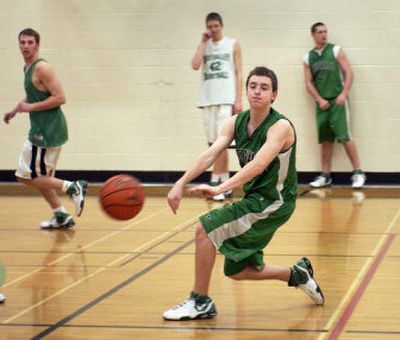 
Emerson Fulton throws a no-look pass during practice. The EV senior broke a bone in his shooting hand at the beginning of the season. He played his first game this season on Dec. 29.
 (J. BART RAYNIAK photos / The Spokesman-Review)