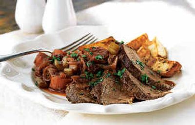 
Zinfandel-Braised Beef Brisket with Onions and Potatoes is a robust dish for chilly days that does not exact a heavy cost in fat and calories. 
 (Associated Press / The Spokesman-Review)