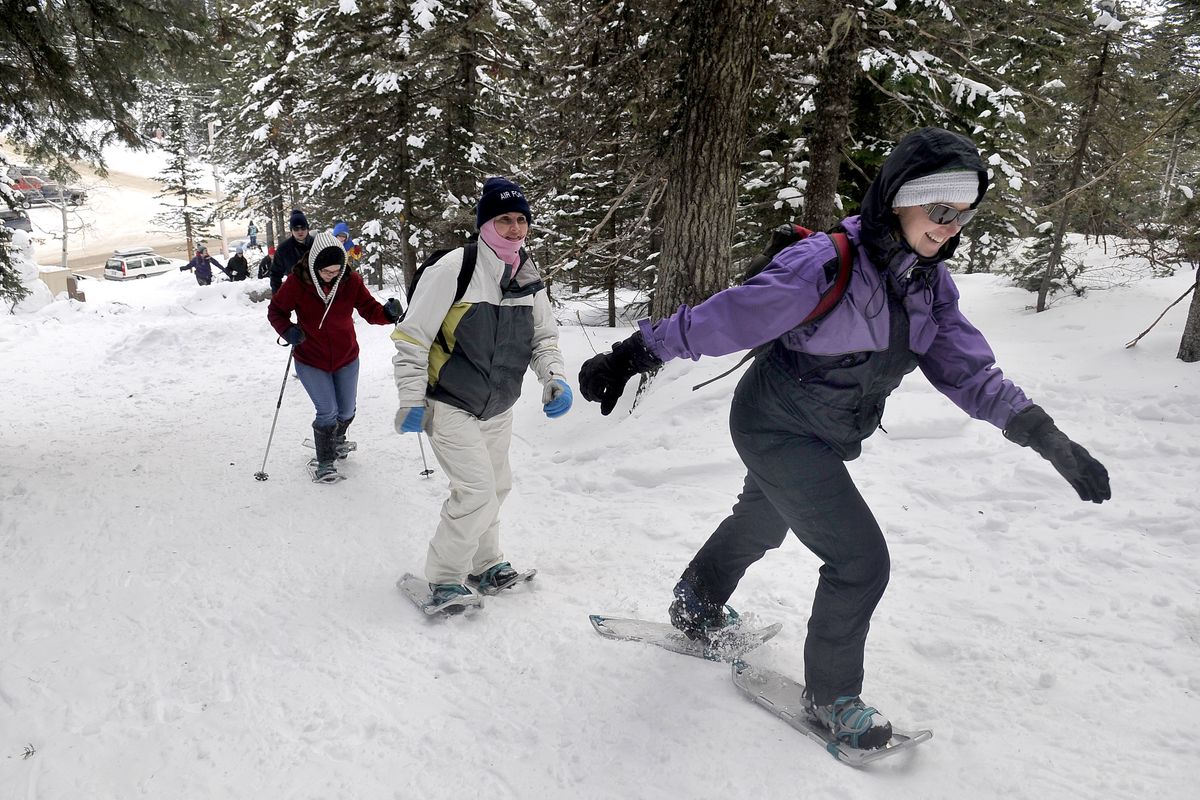 Tammie Maple, right, leads other novice snowshoers up a trail at Mount Spokane State Park on Saturday. The group was part of a Spokane Parks and Recreation outing, but Saturday was also a day when people could go into state parks without the $30 annual Discover Pass. (Jesse Tinsley)