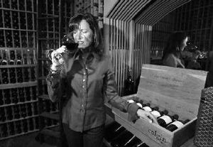 
Ann Colgin samples a glass of Cabernet Sauvignon in the wine library of her winery in St. Helena, Calif., 
 (Associated Press / The Spokesman-Review)