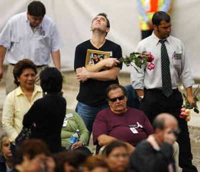 
Family members of victims killed at the World Trade Center on Sept. 11 gather Saturday in New York. Since the attacks, Americans have debated the best way to protect the nation from more terrorist attacks.
 (Associated Press / The Spokesman-Review)