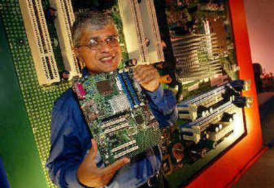 Ketan Sampat, president of Intel India, displays a chipset at a launch event recently in New Delhi, India. Intel claims the new Intel Express chipsets will enhance digital home and office computer experience with improved audio, video and graphics.
(Associated Press / The Spokesman-Review)
