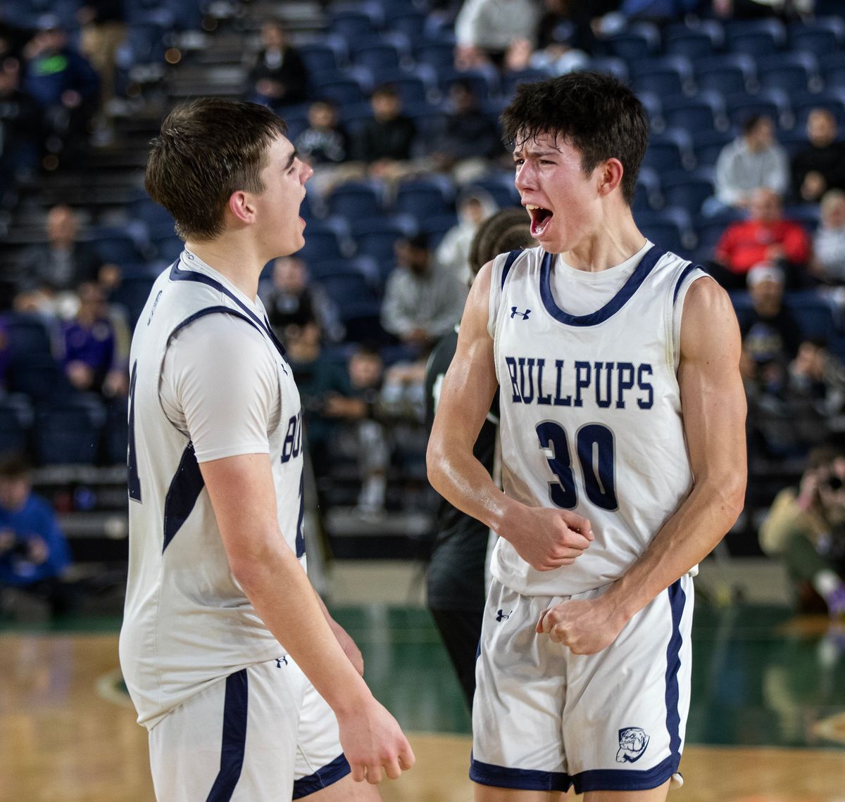 Gonzaga Prep’s Jackson Mott, left, and Carter Nelson, celebrate at the buzzer after winning their semi-final game against Emerald Ridge in the 4A Boys State Basketball Tournament in Tacoma, WA, Friday, March 6, 2026. Gonzaga Prep won the game 52-37 to advance to the championship.  (Patrick Hagerty/For The Spokesman-Review)