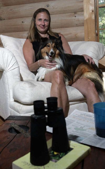 
Janice Pearson sits with her dog at her home in Michigan. Pearson went on her third women-only adventure vacation in June.
 (Associated Press / The Spokesman-Review)