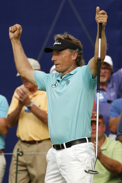 Bernhard Langer celebrates after finishing off his third Champions Tour major title with a birdie putt. (Associated Press)