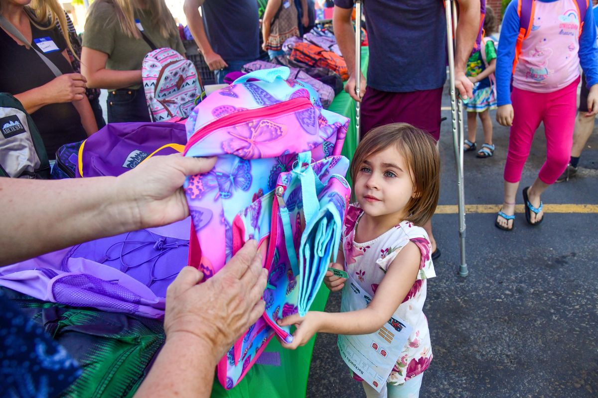 Octavia Jensen was in line for the 12th annual Backpacks for Kids event on Wednesday.  (DAN PELLE/THE SPOKESMAN-REVIEW)