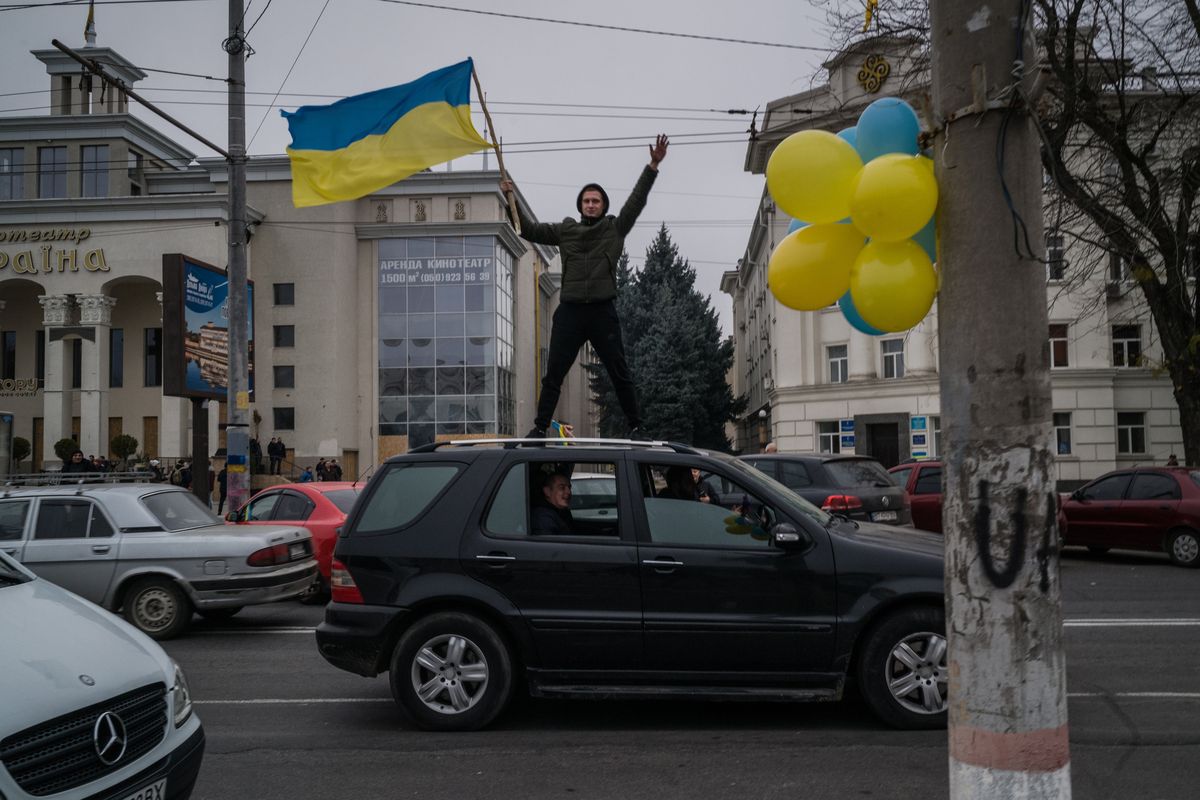 People gathered in Kherson’s city center on Saturday after Ukrainian forces retook the southern city from Russian forces.  (Wojciech Grzedzinski/For The Washington Post)