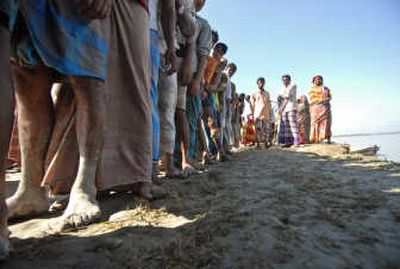 
Cyclone-affected villagers line up for relief materials Monday in Patargata,  Bangladesh. Associated Press
 (Associated Press / The Spokesman-Review)