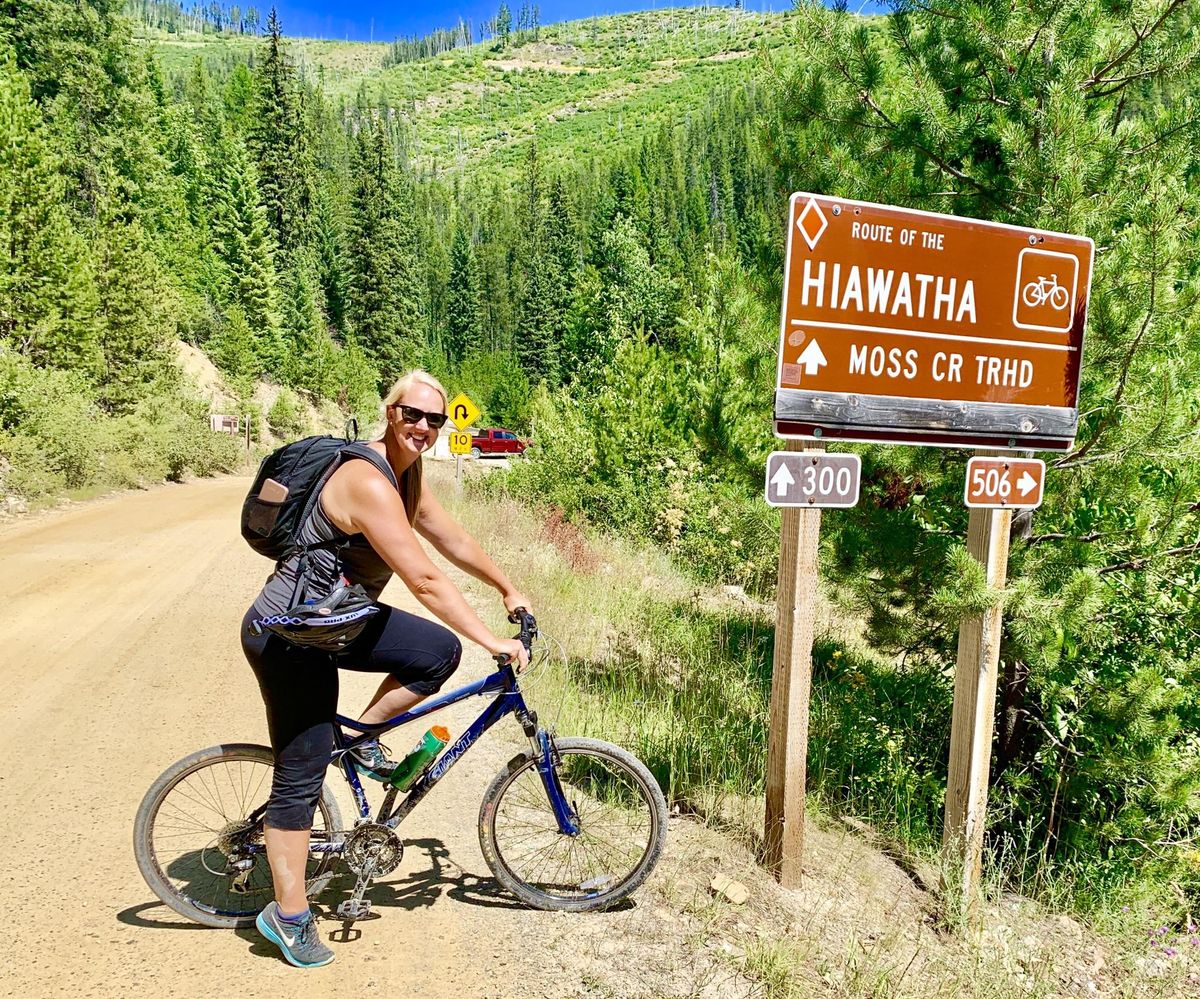 Spokane resident Danielle Beaudine, 39, poses next to the Hiawatha Trail as part of a family bicycle adventure. This activity ranks among 40 personal goals she wants to get done before turning age 40. She lists each completed goal on social media with #40by40. (Courtesy)