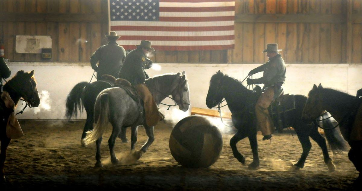 U.S. Border Patrol agents and wranglers play soccer with their mustangs Tuesday, Dec. 16, 2008, at the Mountain House Stables near Colville, Wash. The  Border Patrol has been invited to bring eight horses to Washington, D.C., for the inaugural parade. (Dan Pelle / The Spokesman-Review)