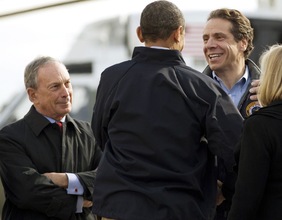 On Nov. 15, President Barack Obama, center, is flanked by New York City Mayor Michael Bloomberg, left, and New York Gov. Andrew Cuomo at John F. Kennedy International Airport in New York. (Associated Press)
