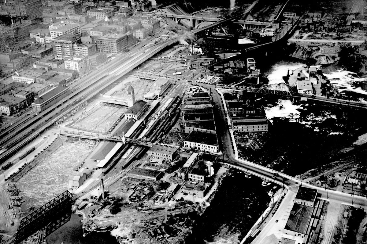 1929: Looking westward and down on Havermale Island  in the Spokane River, this photo shows the land crowded with railroad tracks, warehouses, garages and manufacturing buildings. Pioneer resident Samuel Havermale filed a claim on the island in 1875 and lived there for several years. The committee overseeing Riverfront Park’s redesign has asked that the island be declared a brownfield based on the legacy of pollution by many decades of industrial activity there. (Libby Collection/Eastern Washington State Historical Society Archives / SR)