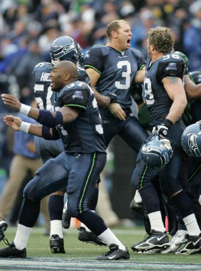
Seahawks kicker Josh Brown (3) celebrates with teammates after his game-winning 50-yard field goal as time expired. 
 (Associated Press / The Spokesman-Review)