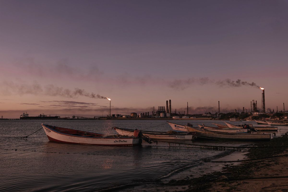 FILE -- In the distance, a refinery near Punto Fijo, Venezuela, Dec. 29, 2021. Shipping data researchers have identified hundreds of cases where a ship has transmitted fake location coordinates in order to carry out murky and even illegal business operations and circumvent international laws and sanctions. (Adriana Loureiro Fernandez/The New York Times)  (ADRIANA LOUREIRO FERNANDEZ)