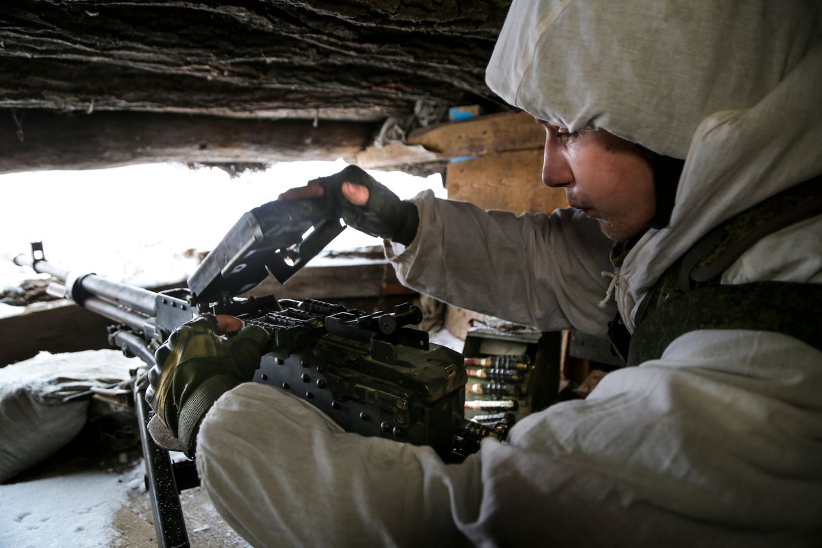 A serviceman checks his machine-gun Tuesday in a shelter on the territory controlled by pro-Russian militants at frontline with Ukrainian government forces in Slavyanoserbsk, Luhansk region, eastern Ukraine.  (Alexei Alexandrov)
