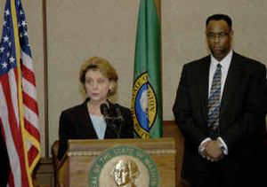 
In this photo provided by the Washington State Patrol, Gov. Christine Gregoire talks Tuesday in Olympia about appointing John Batiste, right, chief of the Washington State Patrol. Batiste is currently deputy chief of the Port of Seattle police.
 (Associated Press / The Spokesman-Review)