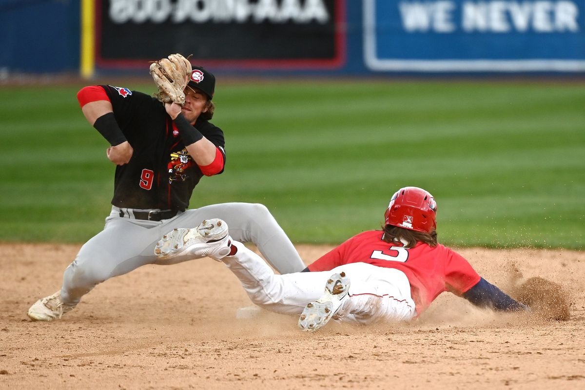 Spokane Indians outfielder Zac Veen (3) slides safely into second against Vancouver Canadians infielder Addison Barger (9) during a Northwest League baseball game at Avista Stadium on Sun, April. 10, 2022 in Spokane WA.  (James Snook/For The Spokesman-Review)