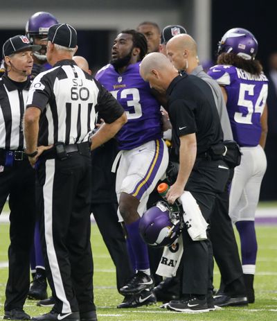 Minnesota Vikings running back Dalvin Cook (33) is helped off the field after being injured during the second half of an NFL game against the Detroit Lions, Sunday, Oct. 1, 2017, in Minneapolis. (Jim Mone / Associated Press)