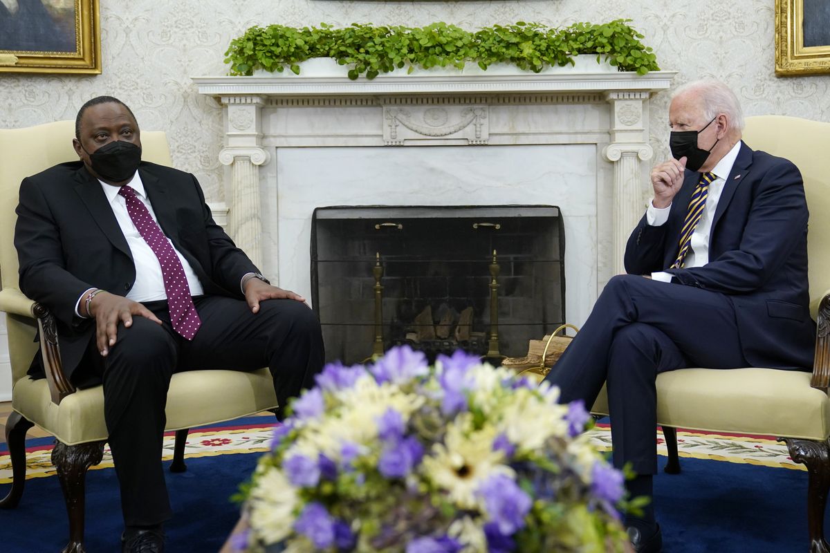 President Joe Biden, right, listens as Kenyan President Uhuru Kenyatta, left, speaks during their meeting in the Oval Office of the White House in Washington, Thursday, Oct. 14, 2021.  (Susan Walsh)