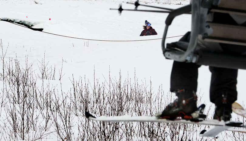 Skiers and snowboarders dodge weeds and bare spots at Schweitzer Mountain Resort in December. (Kathy Plonka)