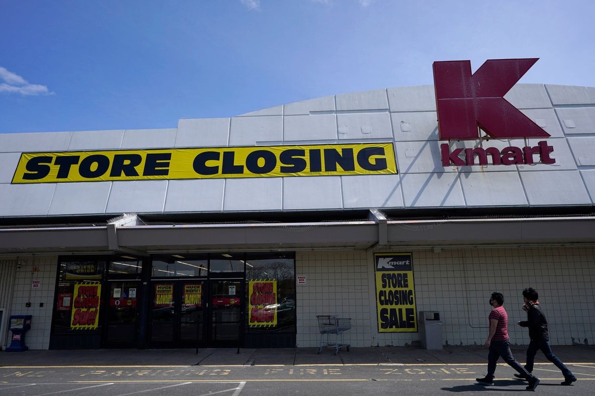 People walk into a Kmart on April 4 in Avenel, N.J. When the New Jersey store closes its doors on April 16, it will leave only three remaining U.S. locations for the former retail powerhouse.  (Seth Wenig)