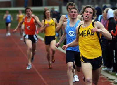 
Mead's Jordan Curnutt pulls ahead of the pack in the stretch to win Thursday's 800-meter run. 
 (Rajah Bose / The Spokesman-Review)