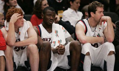
Zags, from left, David Pendergraft, Abdullahi Kuso and Sean Mallon watch from the bench in the closing minute.
 (Associated Press / The Spokesman-Review)