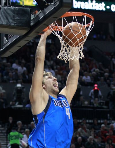 Dallas Mavericks' Dirk Nowitzki dunks for two of his 33 points. (Associated Press)